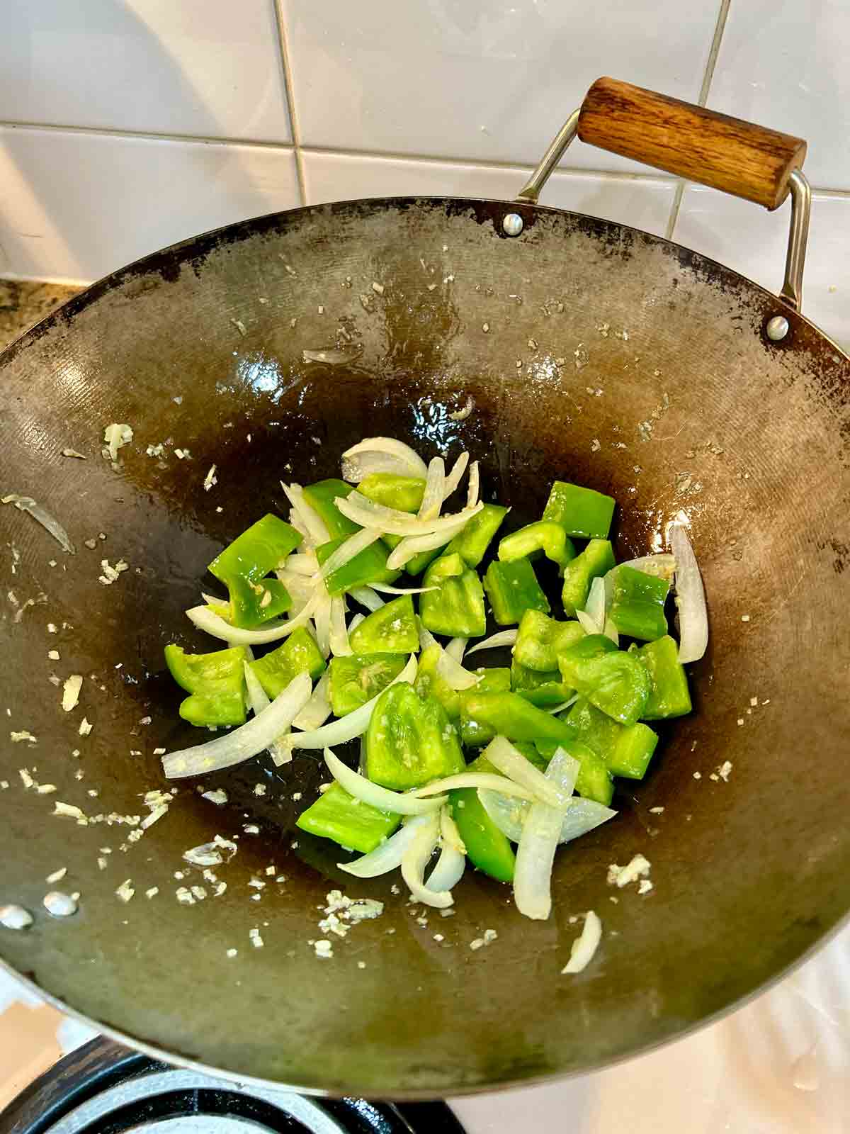 green peppers added to wok.