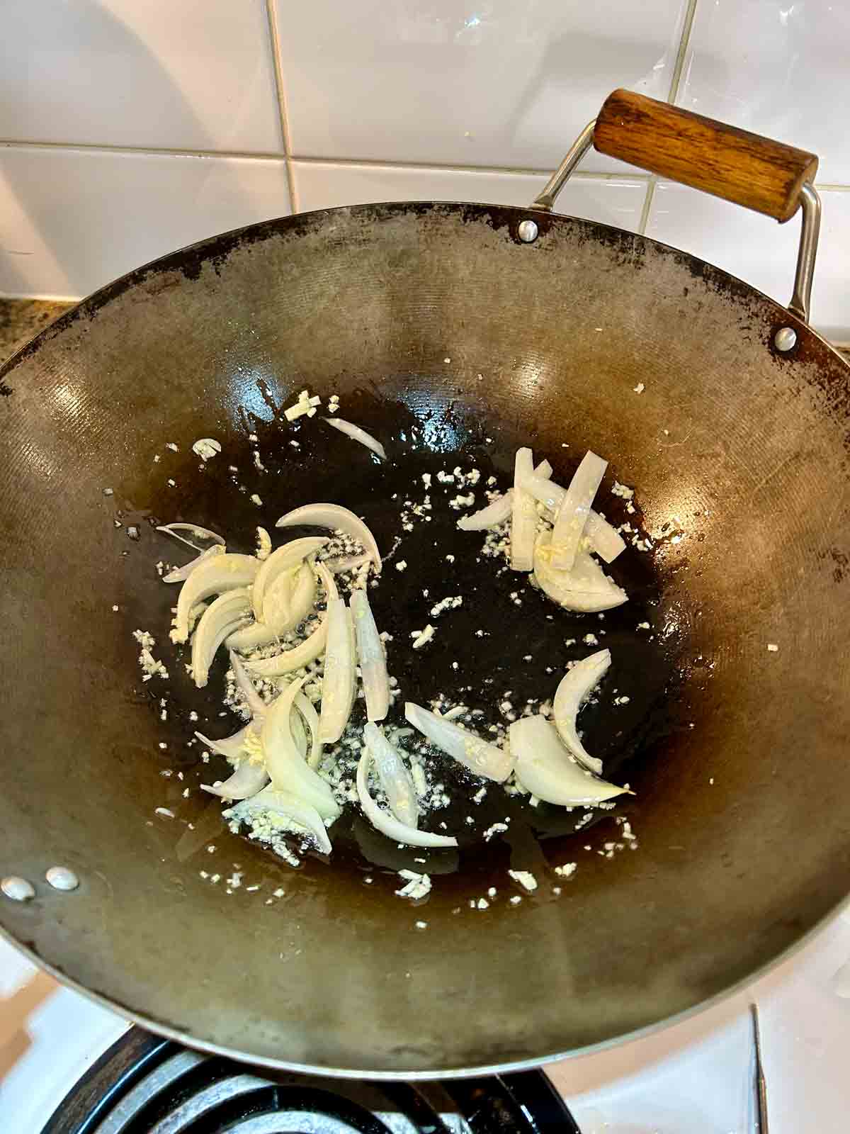 garlic and onions cooking in wok.