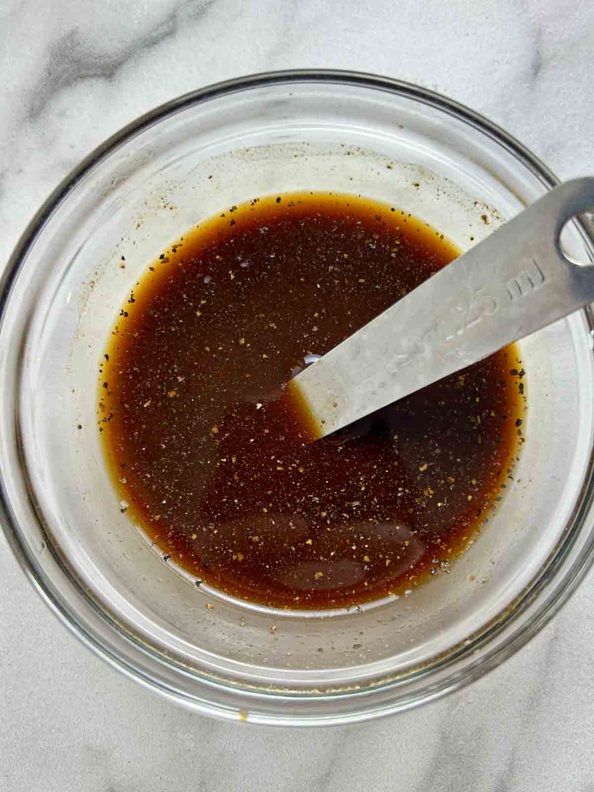 black pepper sauce mixed in bowl.