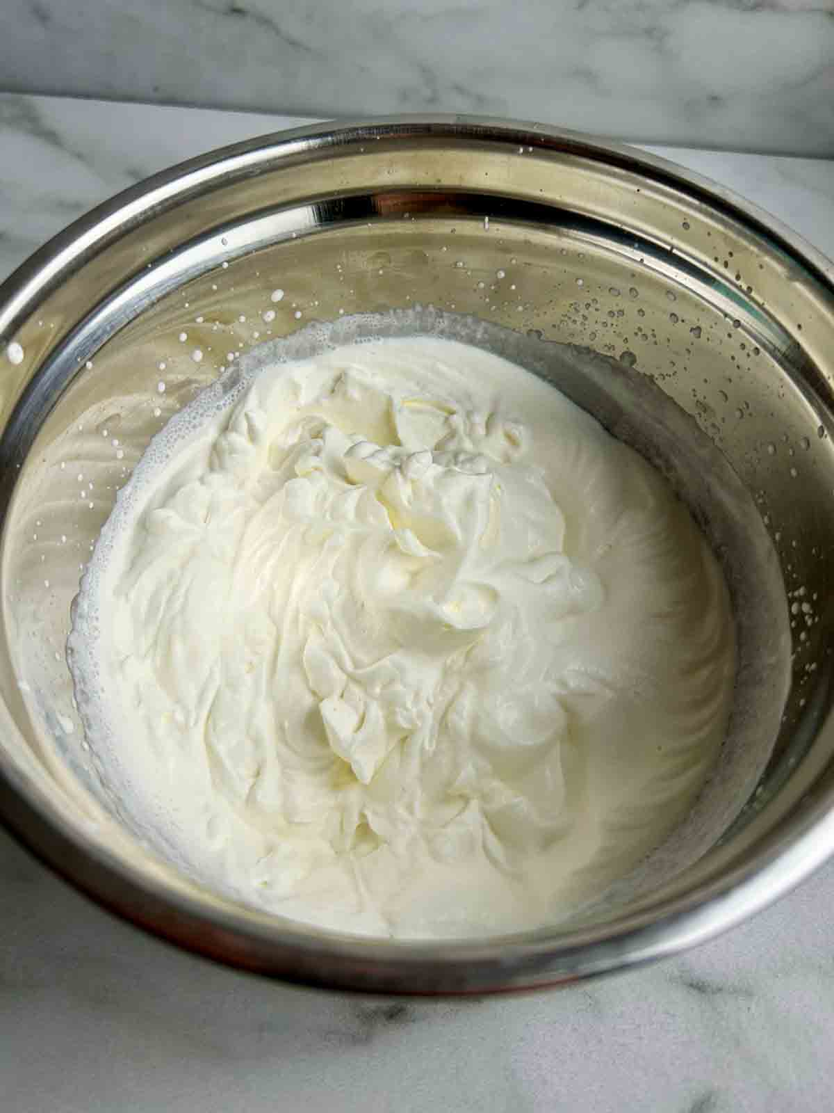 heavy cream whipped to stiff peaks.