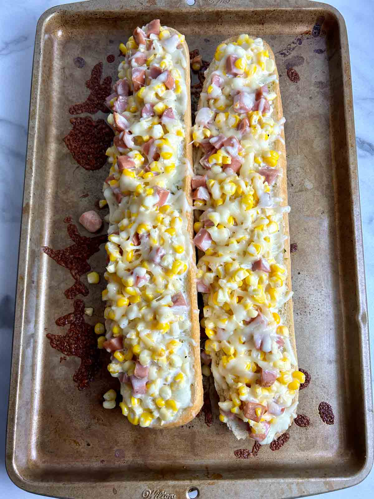 overhead view of ham and corn garlic bread after baking.