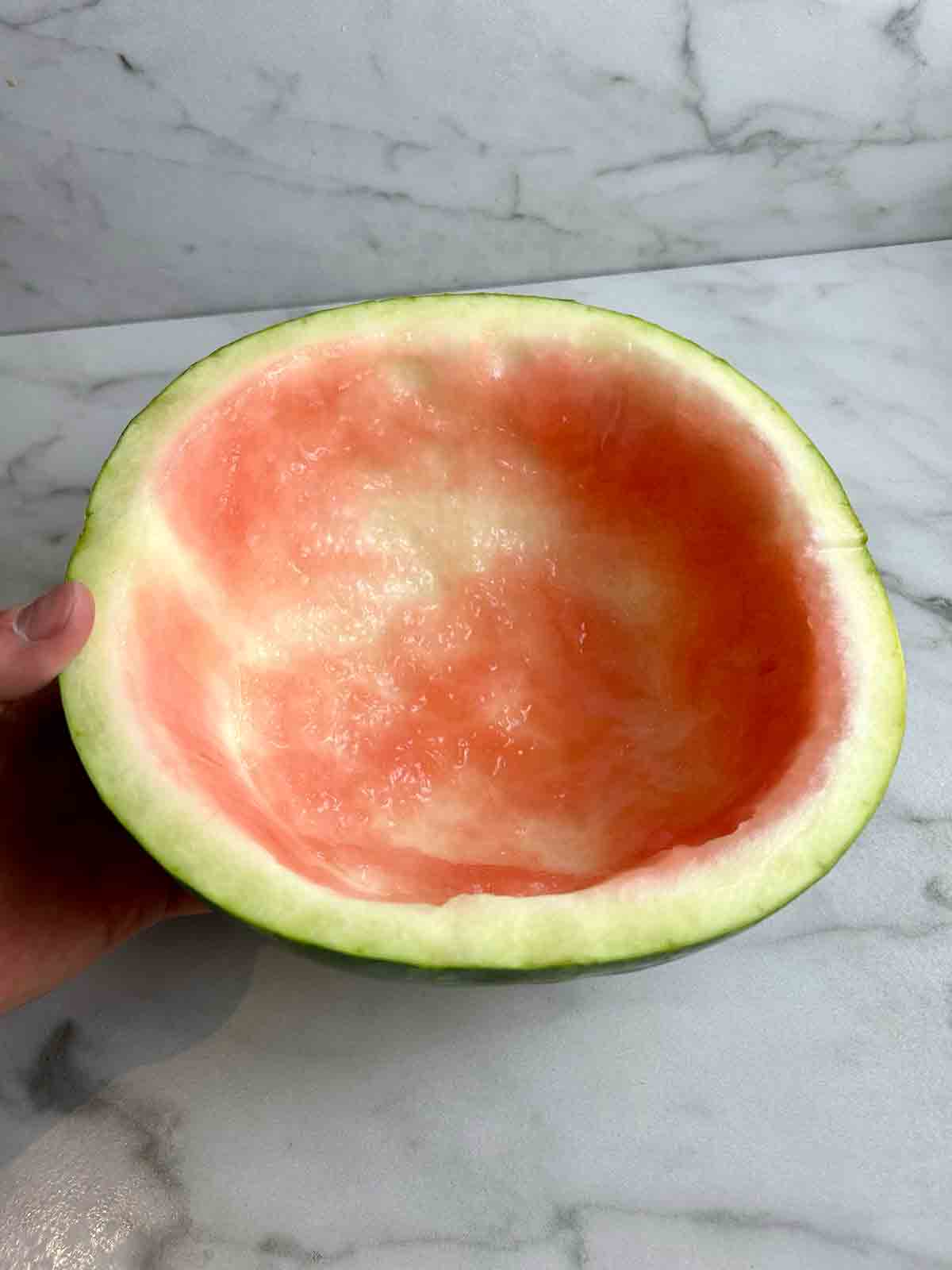 half of watermelon rind with inside scooped out.