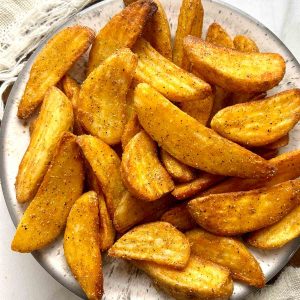 overhead shot of Chinese buttered potatoes on plate.