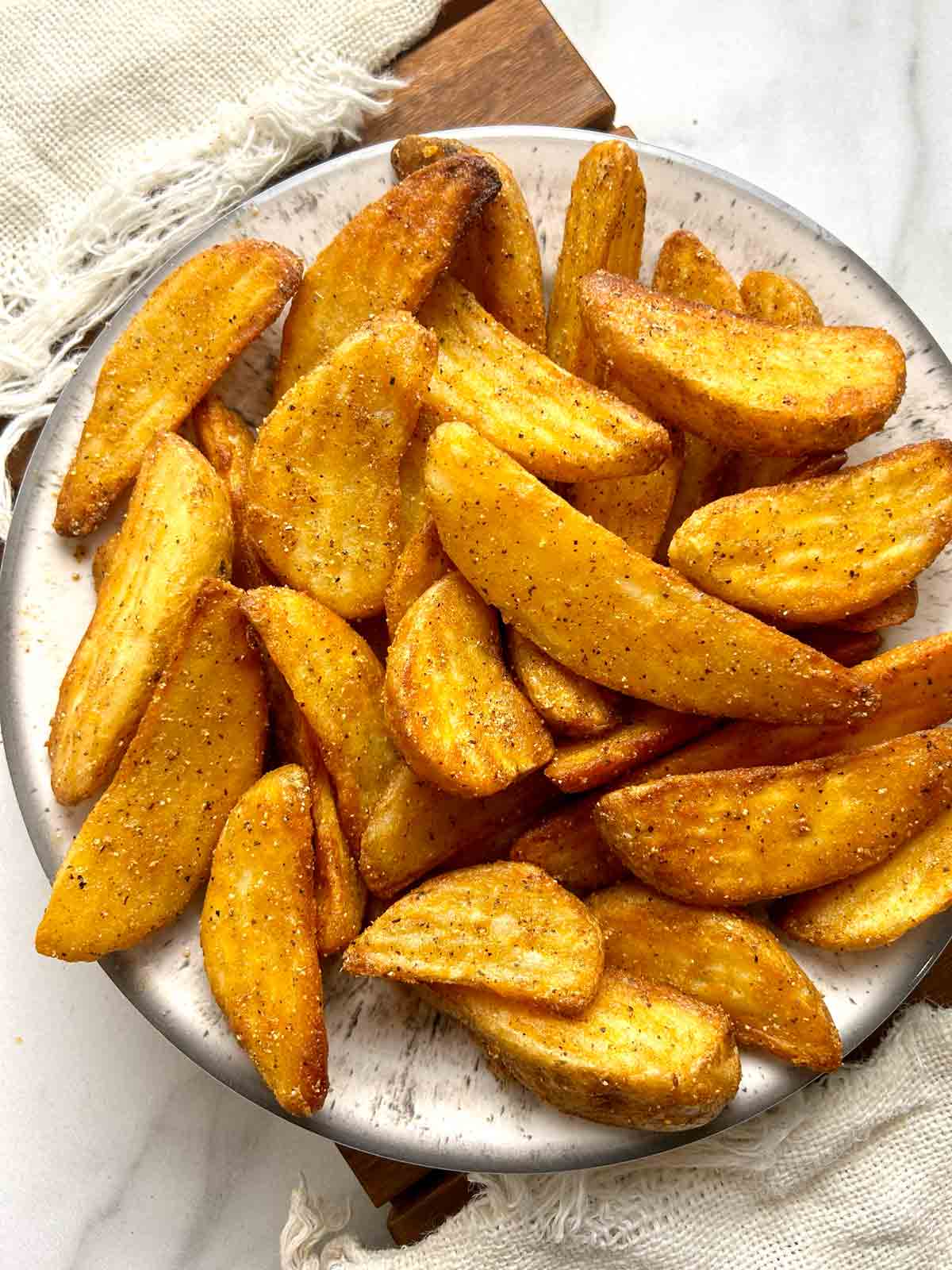 overhead shot of Chinese buttered potatoes on plate.