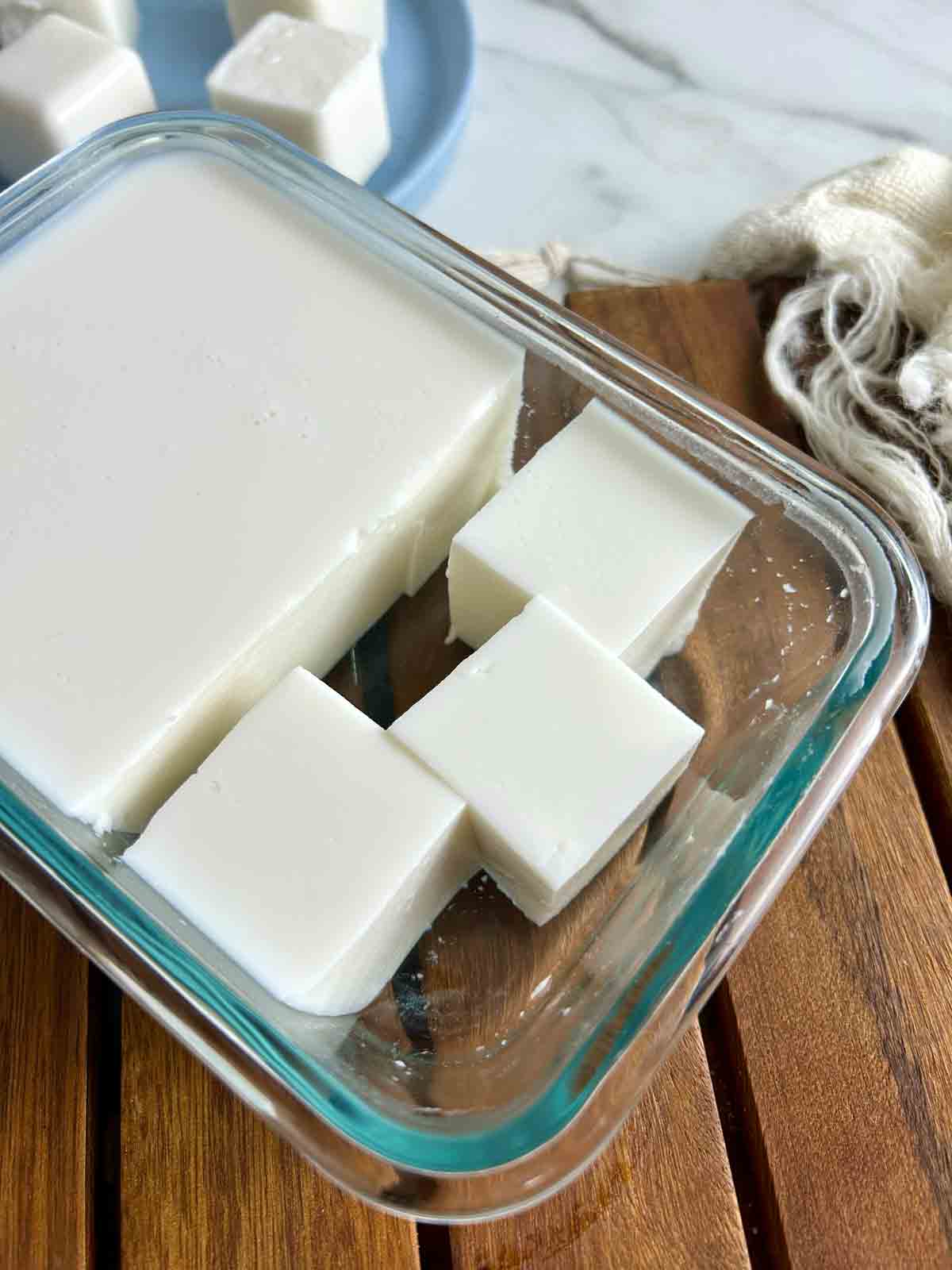 coconut pudding cut into cubes from glass container.