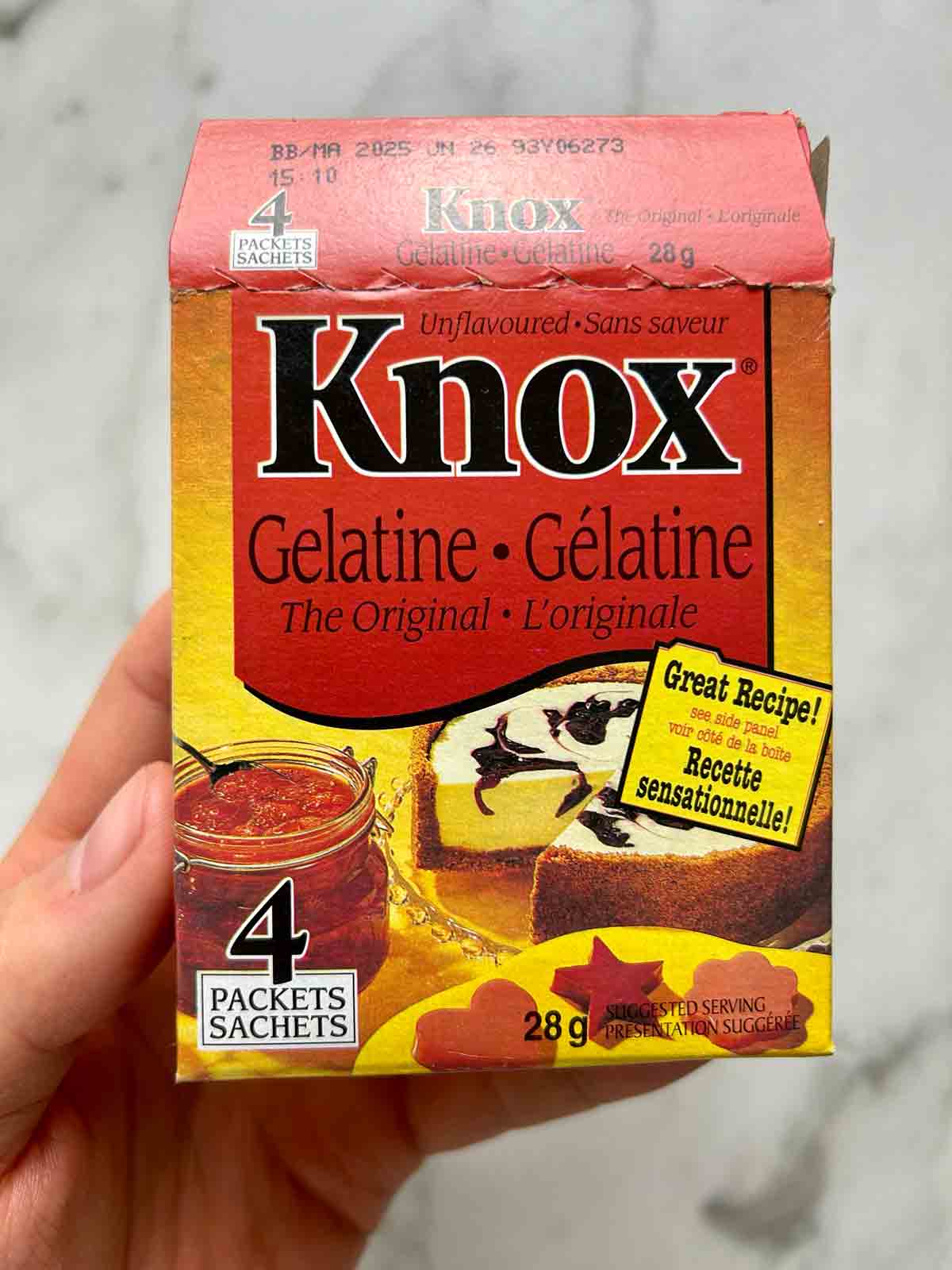 hand holding box of Knox gelatin.