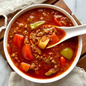 overhead shot of ground beef goulash in bowl.