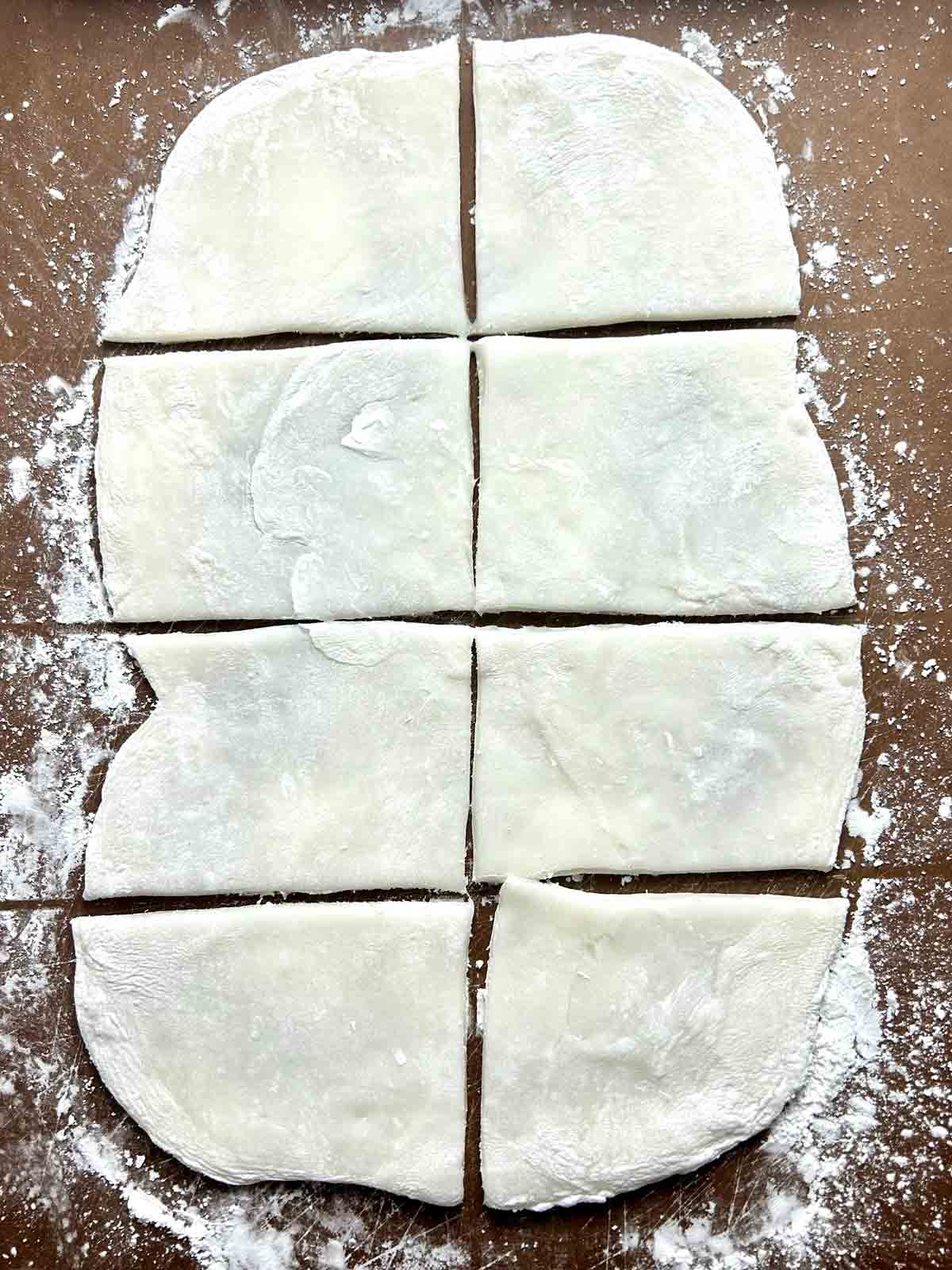 dough rolled into rectangle and cut into 8 portions.