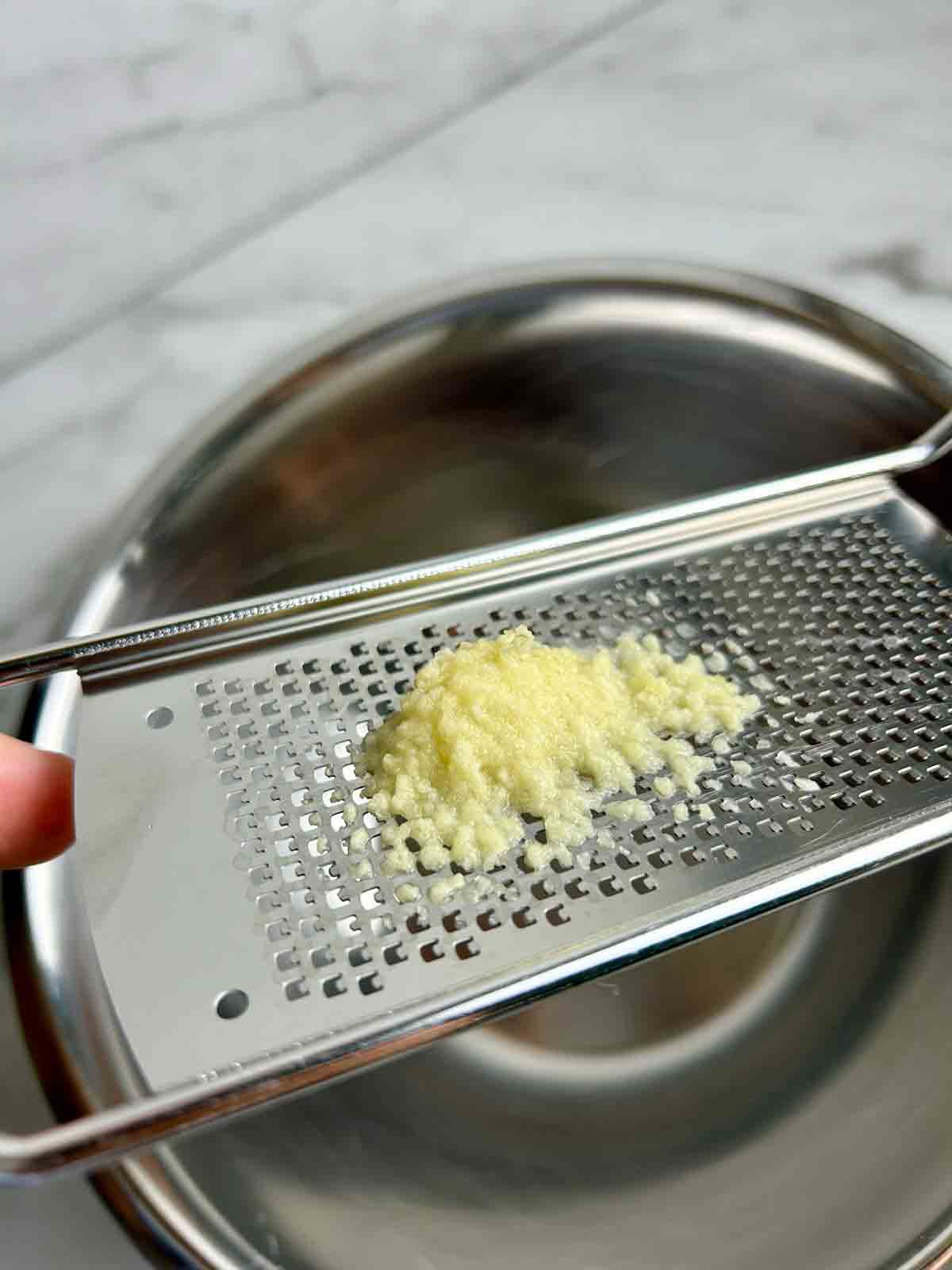 grated garlic on back side of microplane.