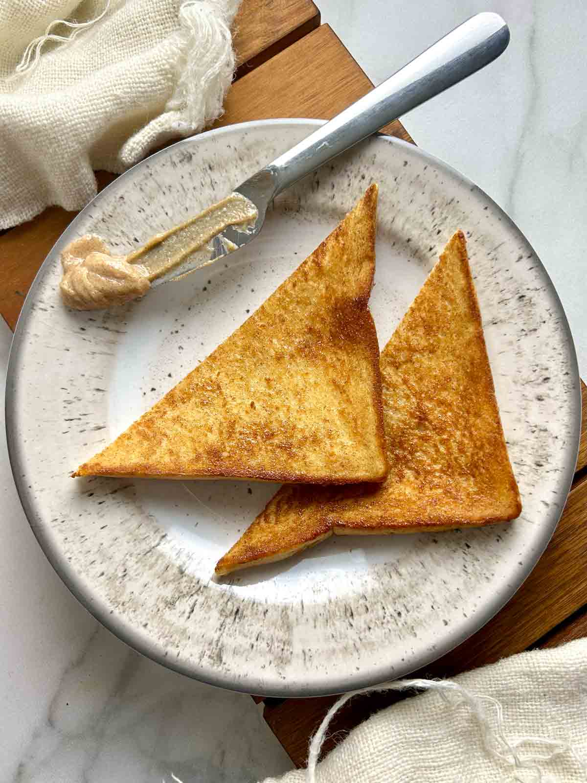 two slices of brown sugar toast on plate.