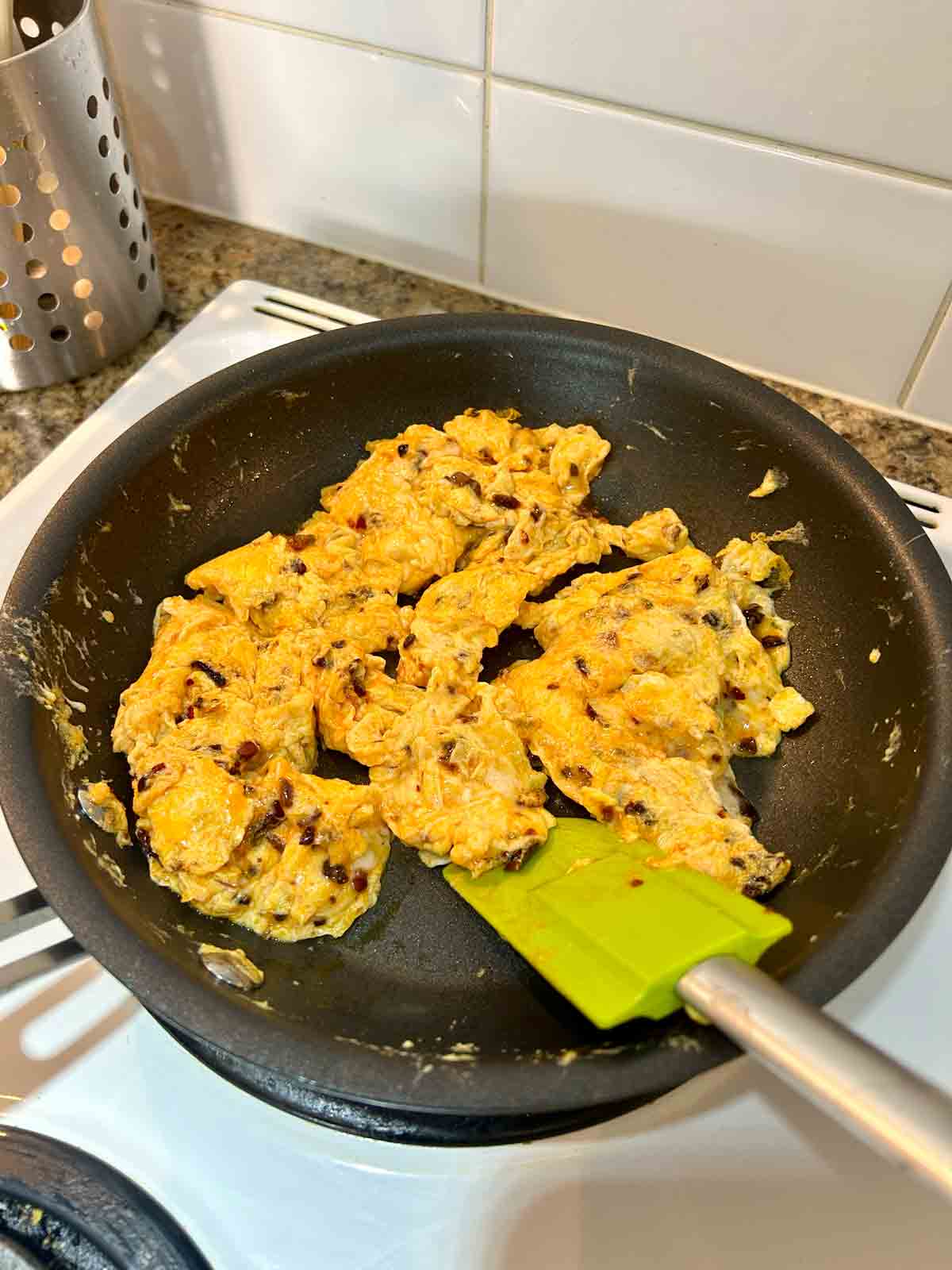 chili oil mixed directly into scrambled eggs.