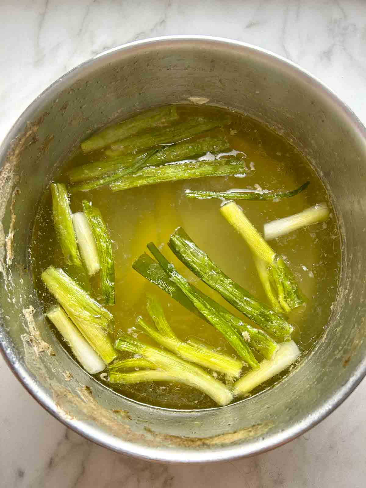 chicken stock cooking in pot.