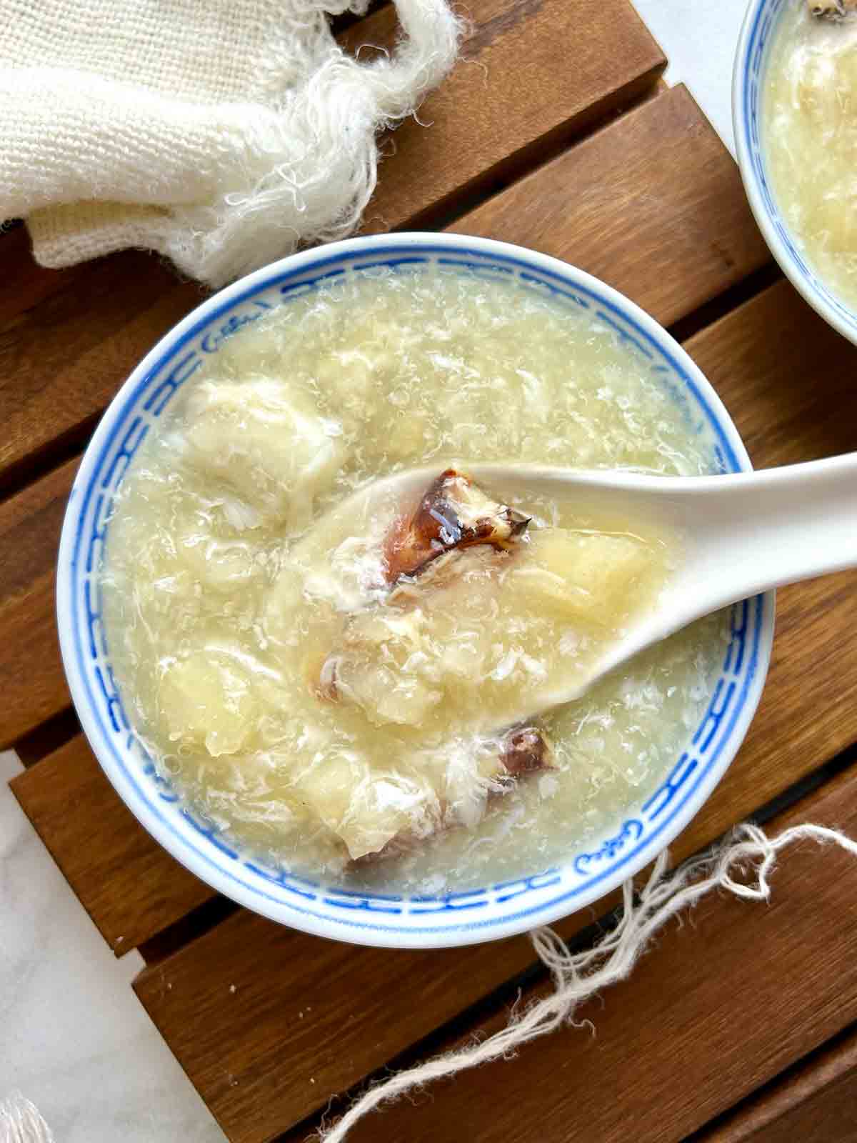 overhead shot of Chinese fish maw soup in small bowl.