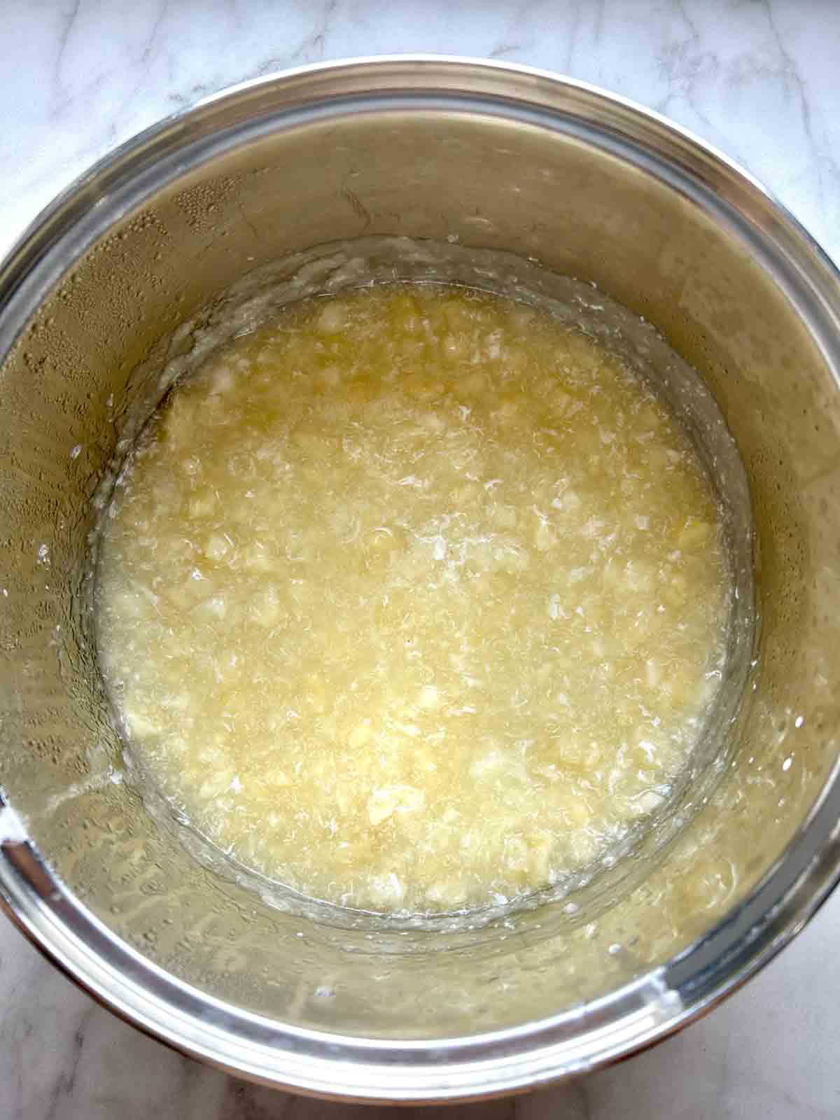 soup being thickened with cornstarch slurry.