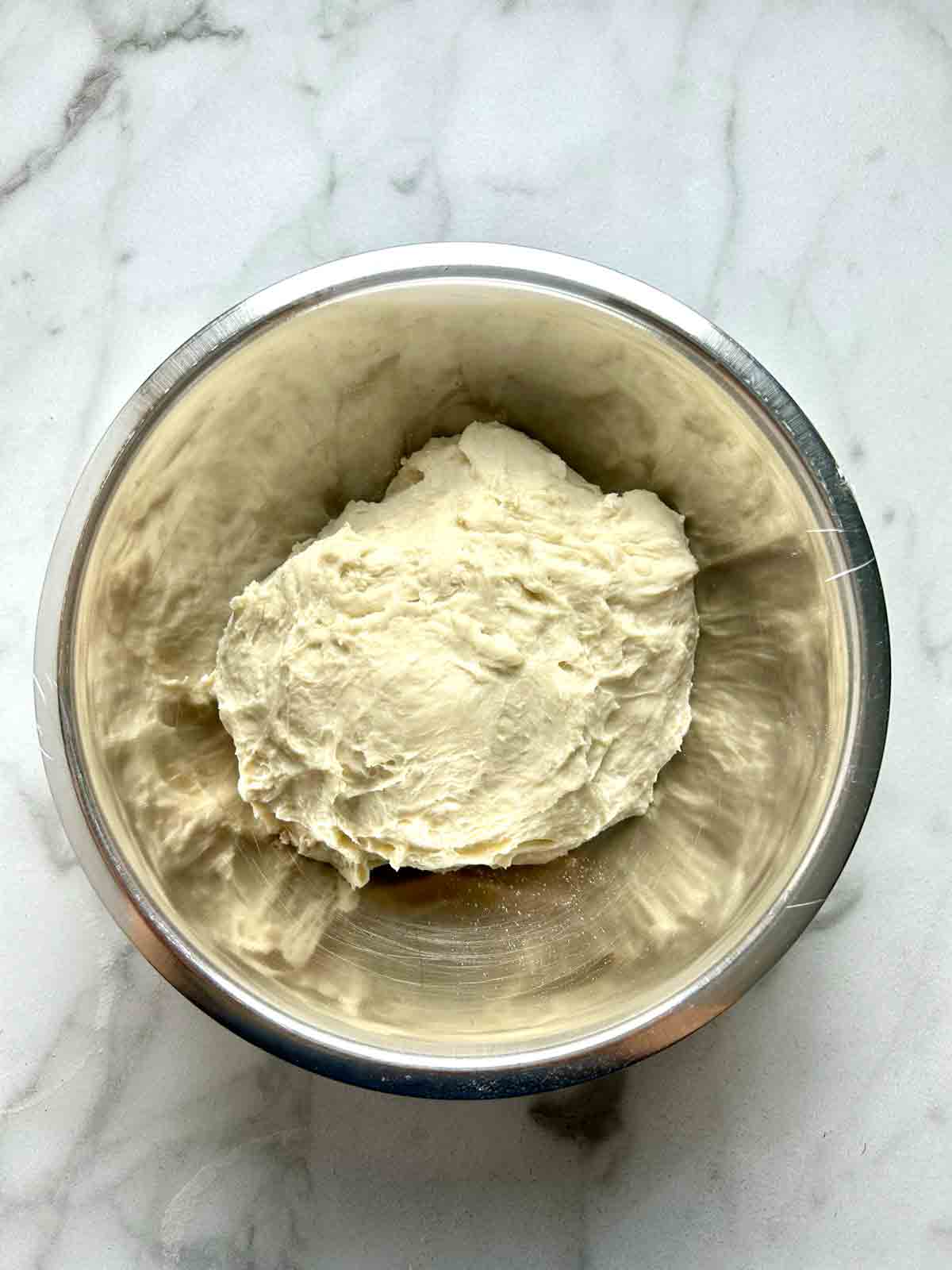 kneaded dough in bowl.