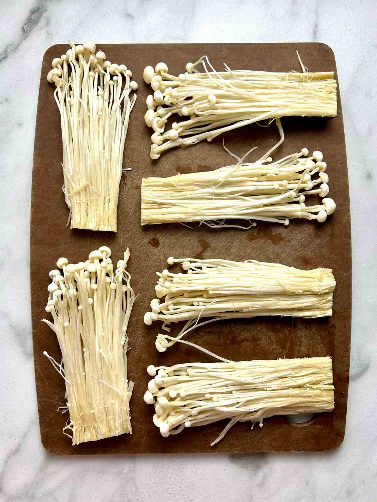 enoki mushrooms cut into thin slabs.