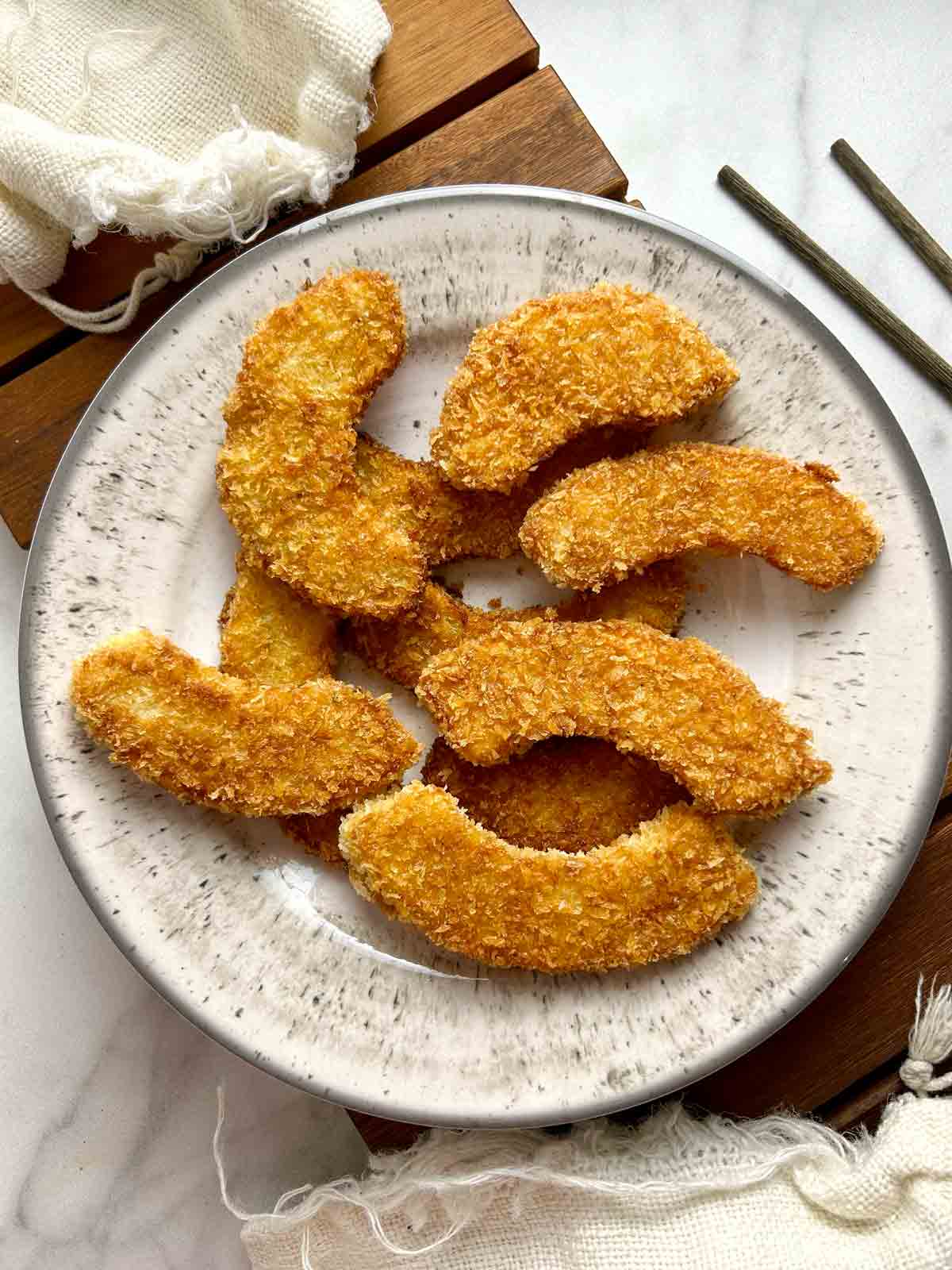 fried pumpkin slices on plate.