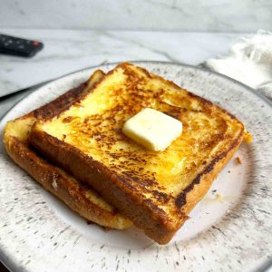 two pieces of milk toast on plate.