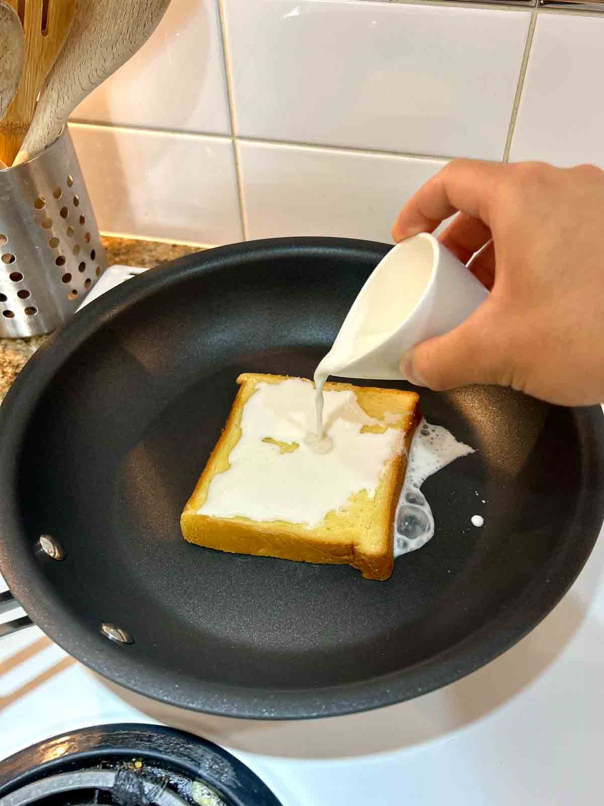 pouring milk onto toast.