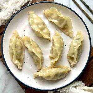 pork and leek dumplings on plate.