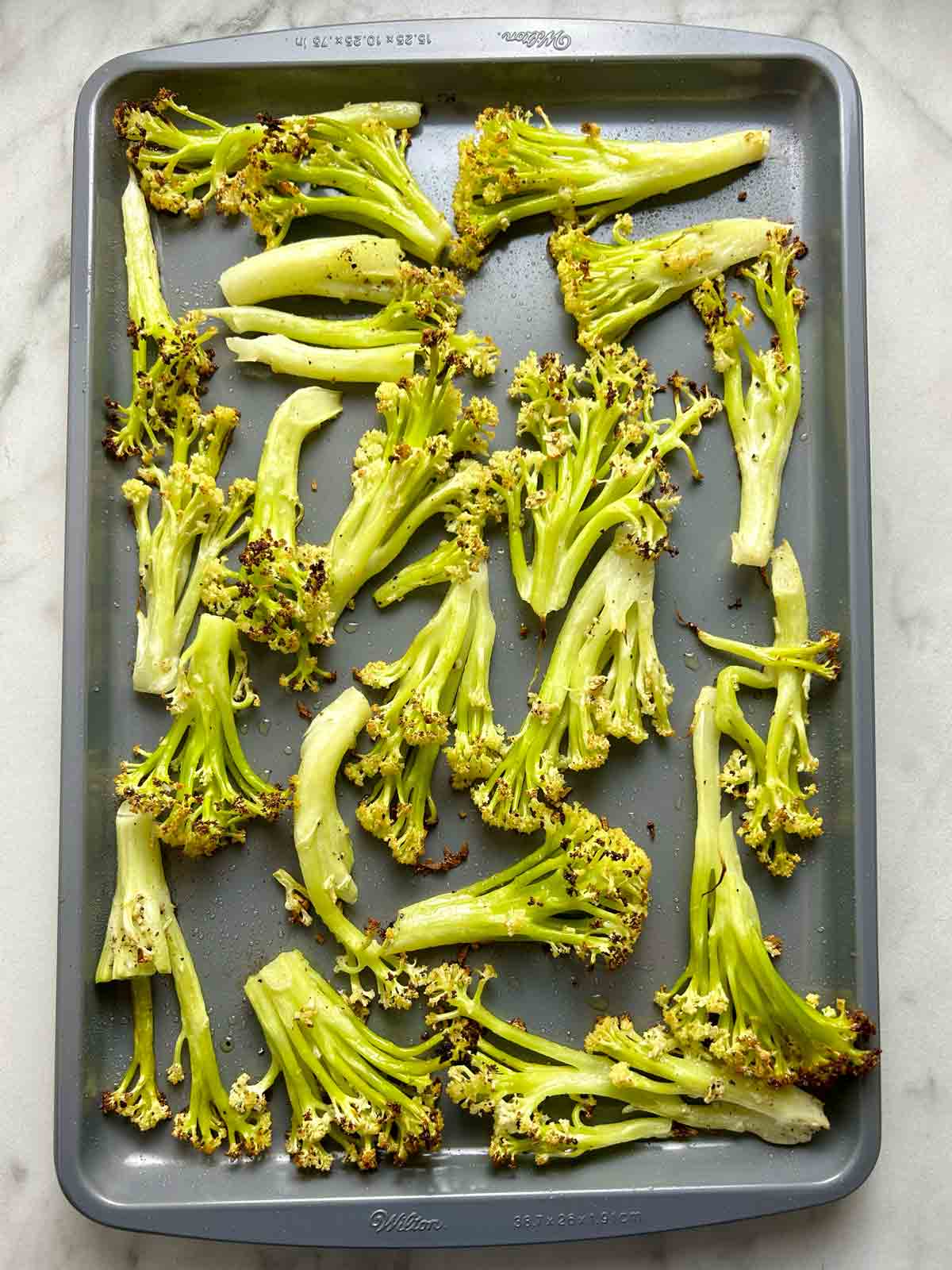 Chinese cauliflower on baking sheet after roasting.