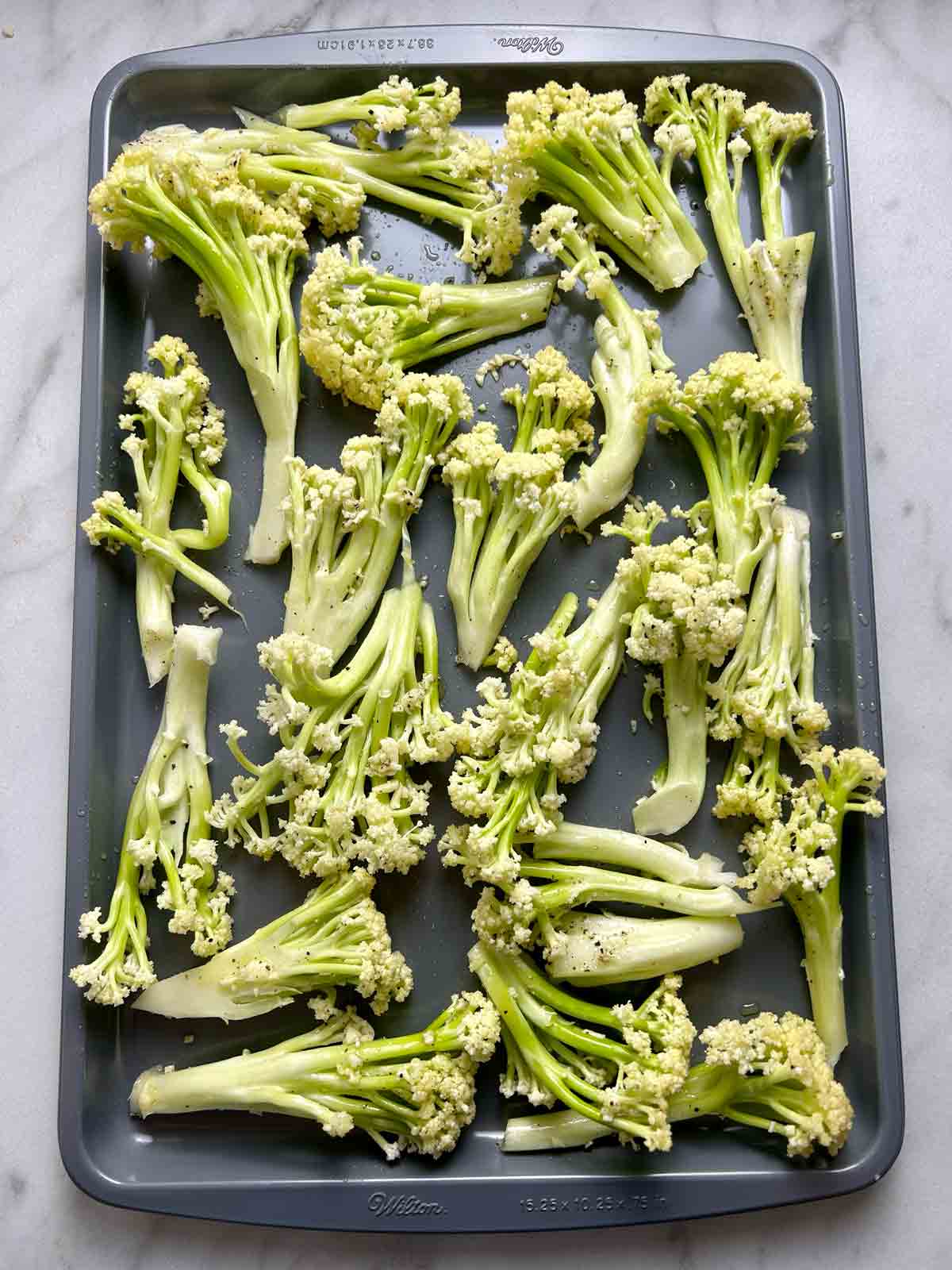 Chinese cauliflower on baking sheet before roasting.