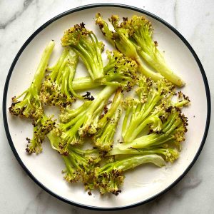 roasted Chinese cauliflower florets on plate.