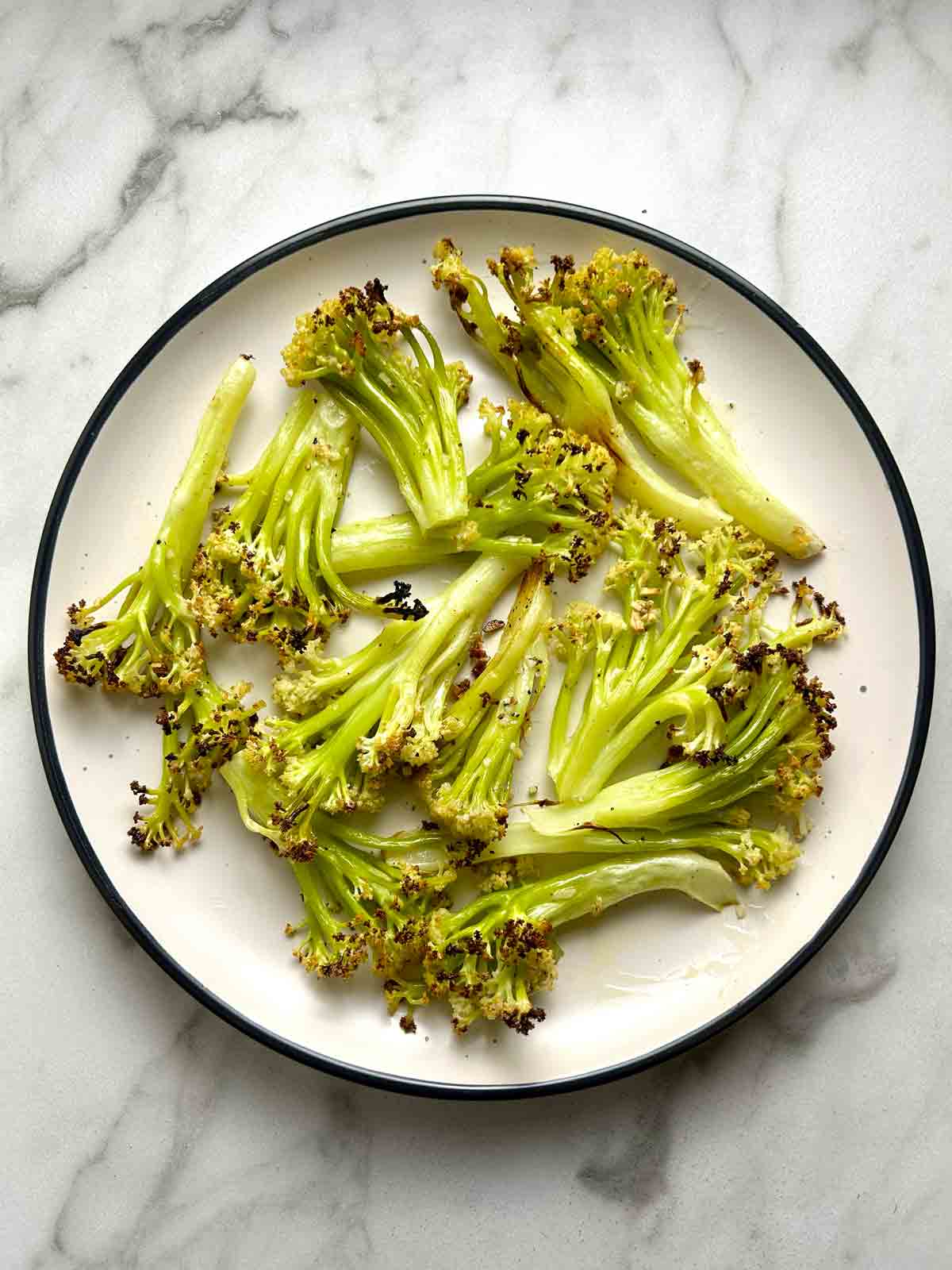 roasted Chinese cauliflower florets on plate.