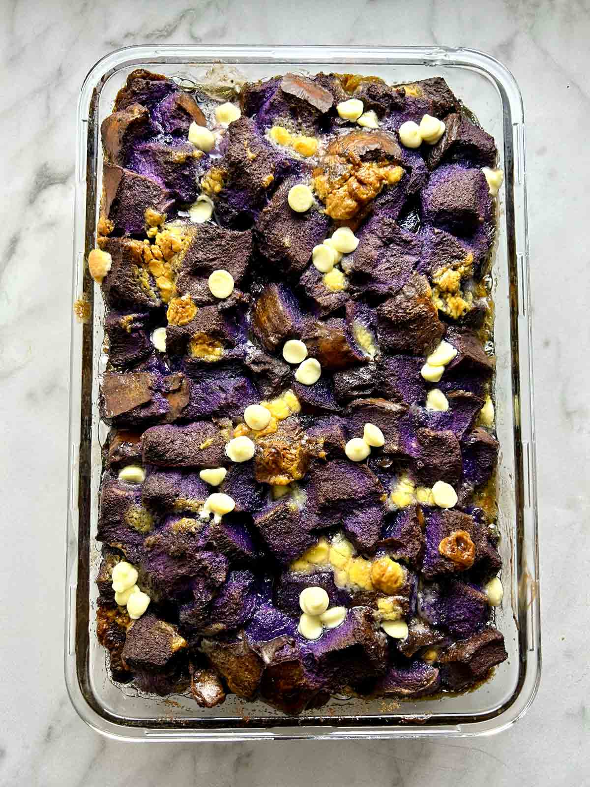 overhead shot of ube bread pudding baked to golden brown.