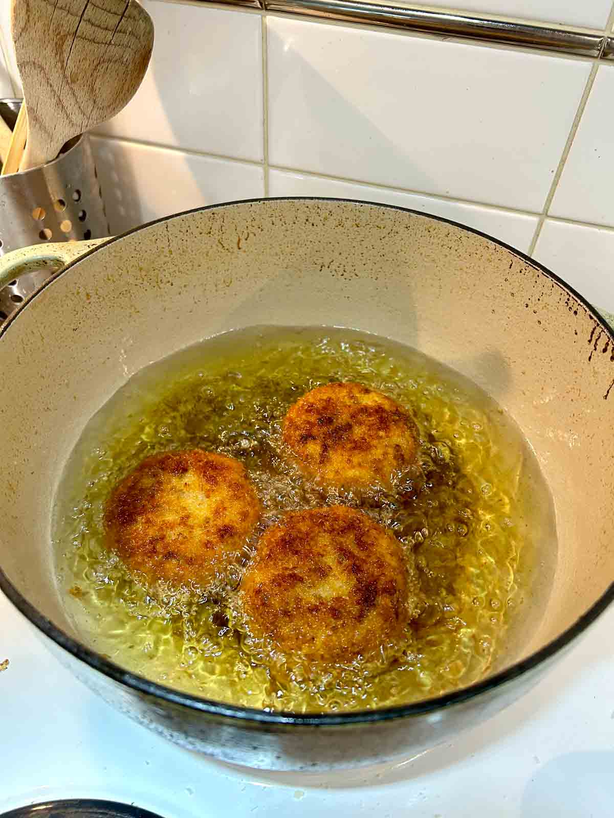 croquettes frying in oil.