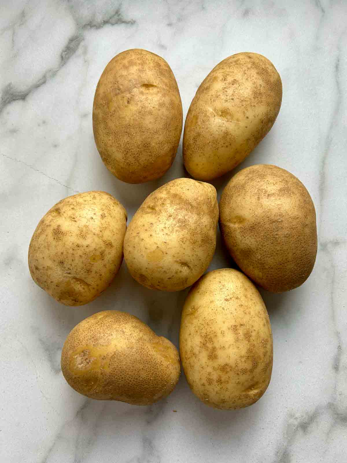 seven medium-sized Russet potatoes.