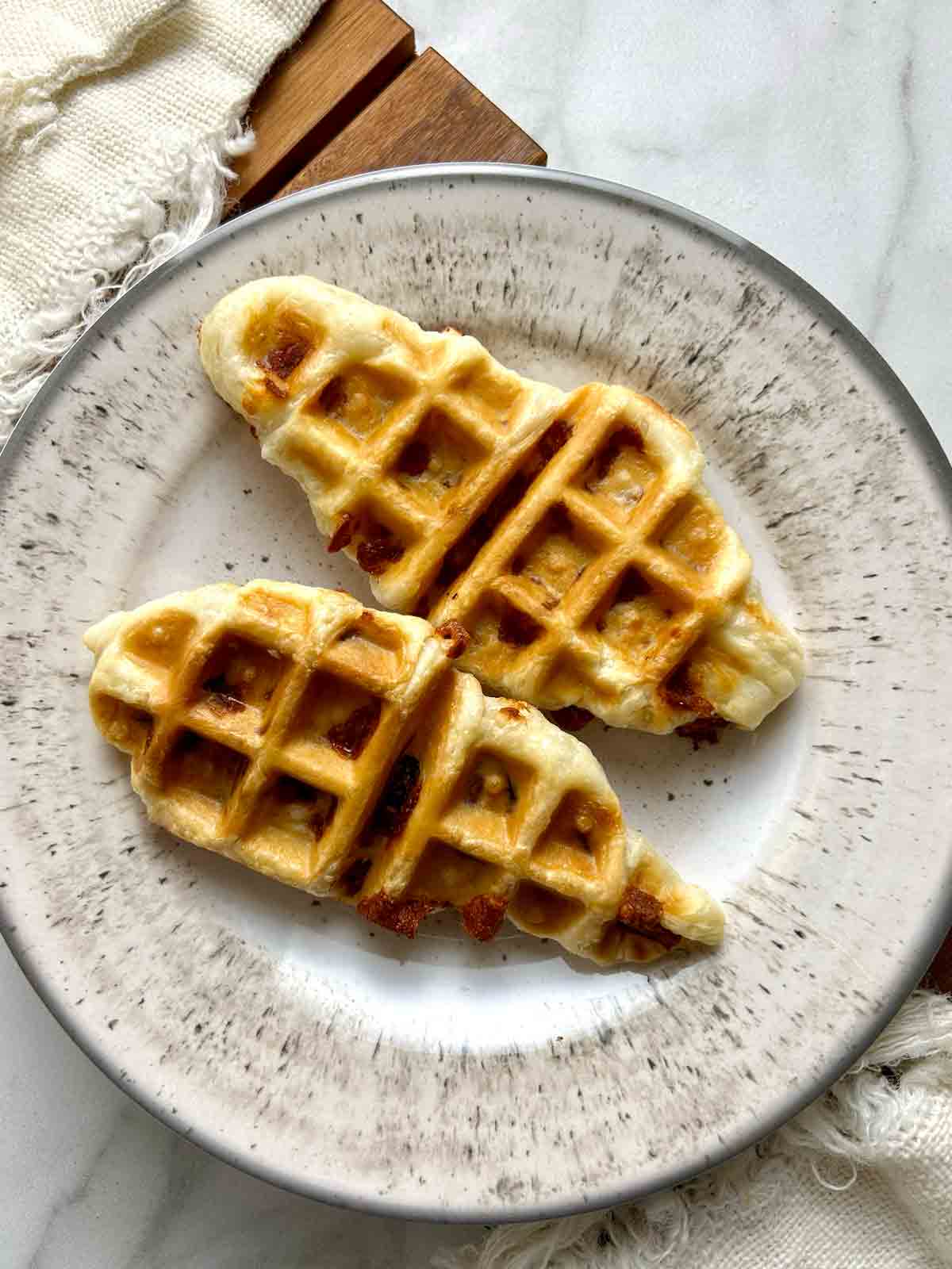 two croffles on plate.