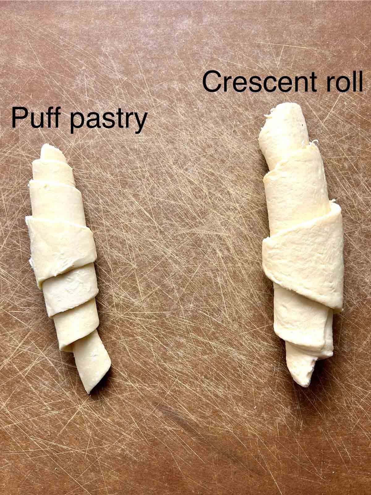 rolled crescent roll and rolled puff pastry next to each other.