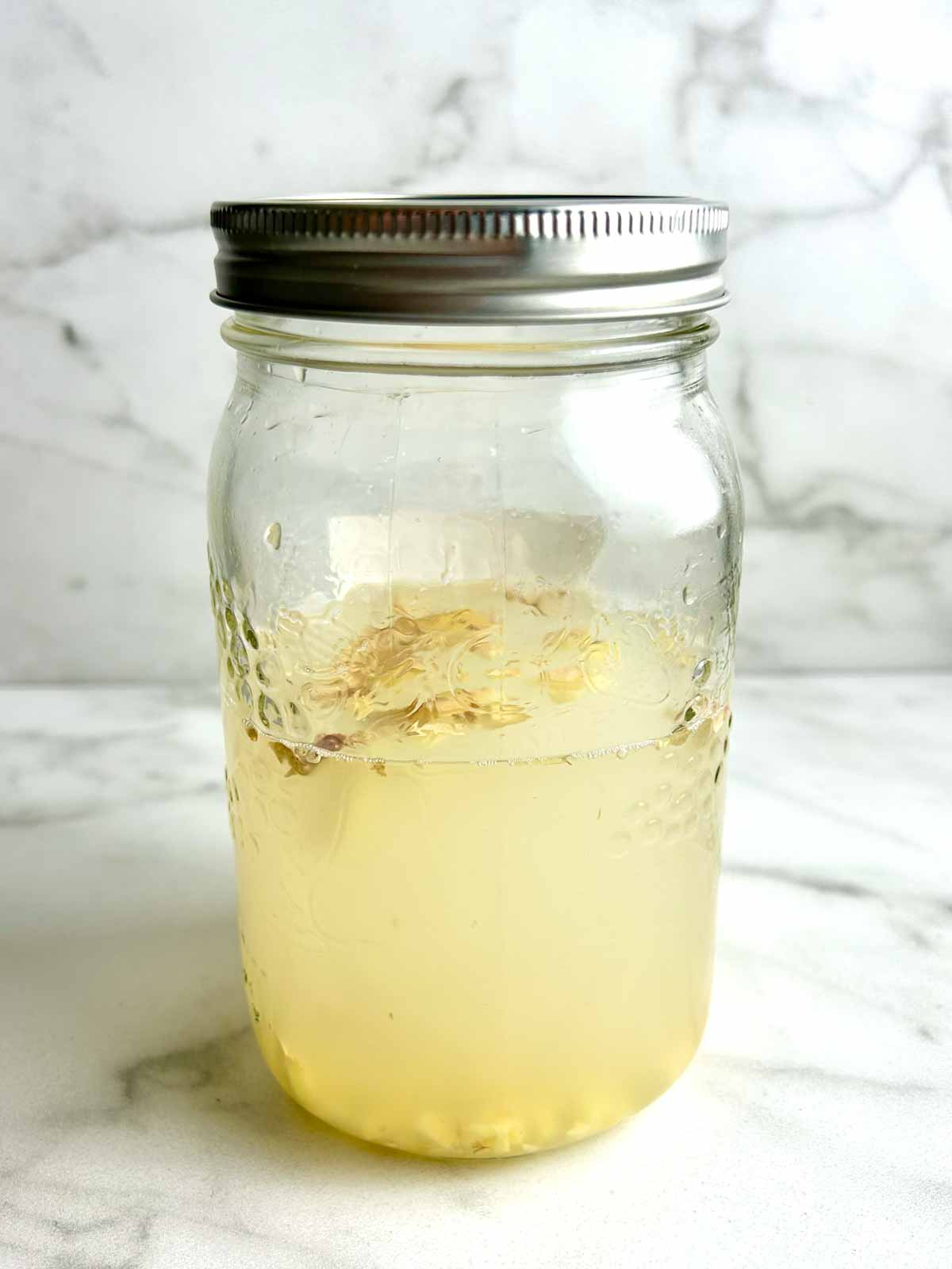 mason jar of ginger bug.