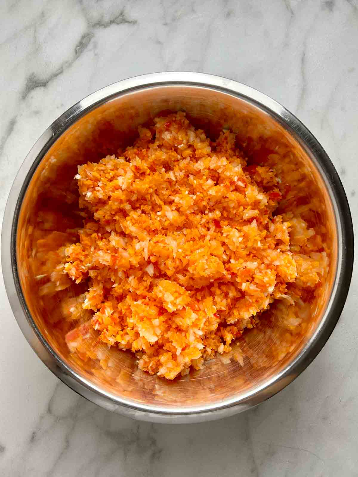 finely chopped carrots, onions, red pepper, and garlic.