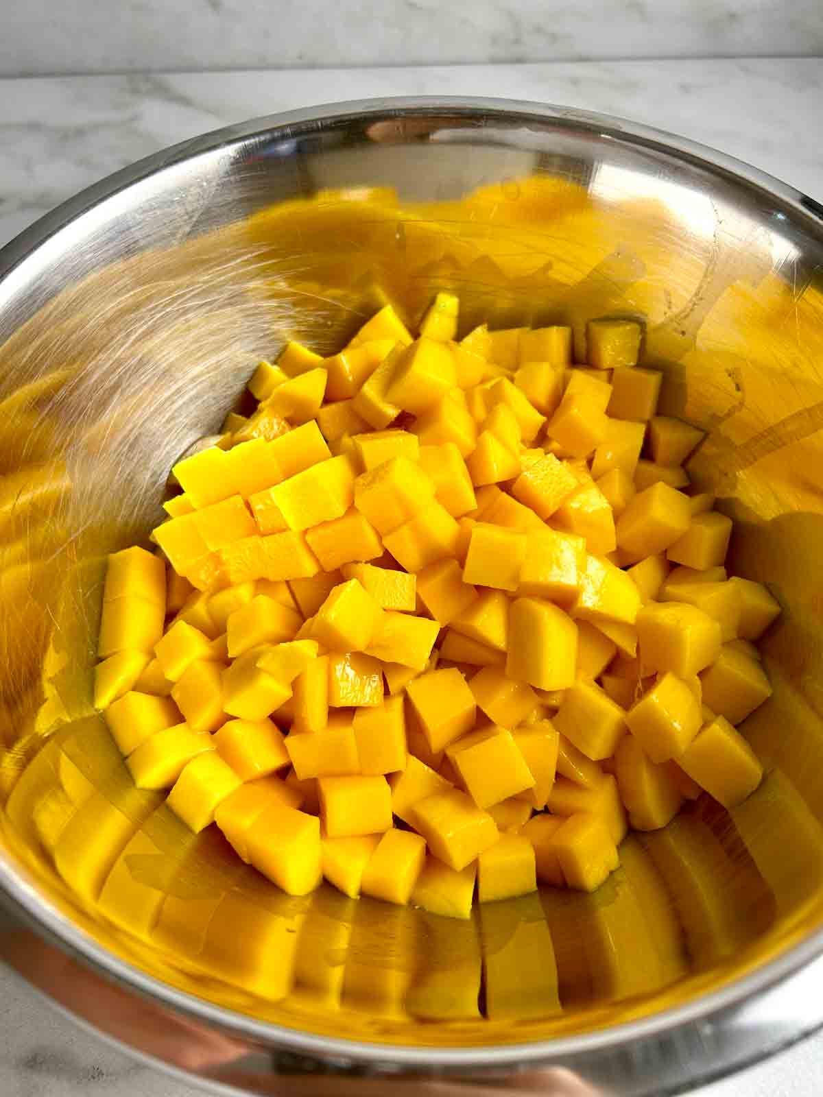 chopped mango in bowl.