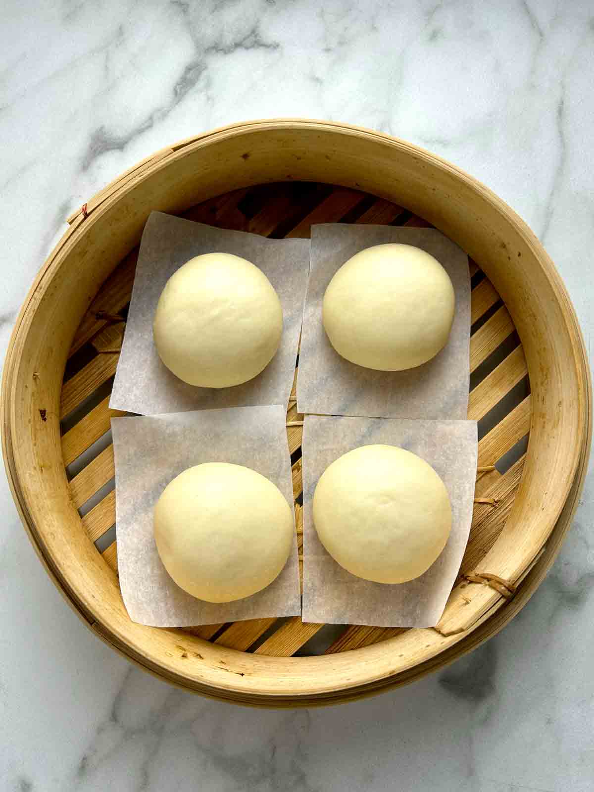 four dough balls 1.5 bigger in size after second proof.