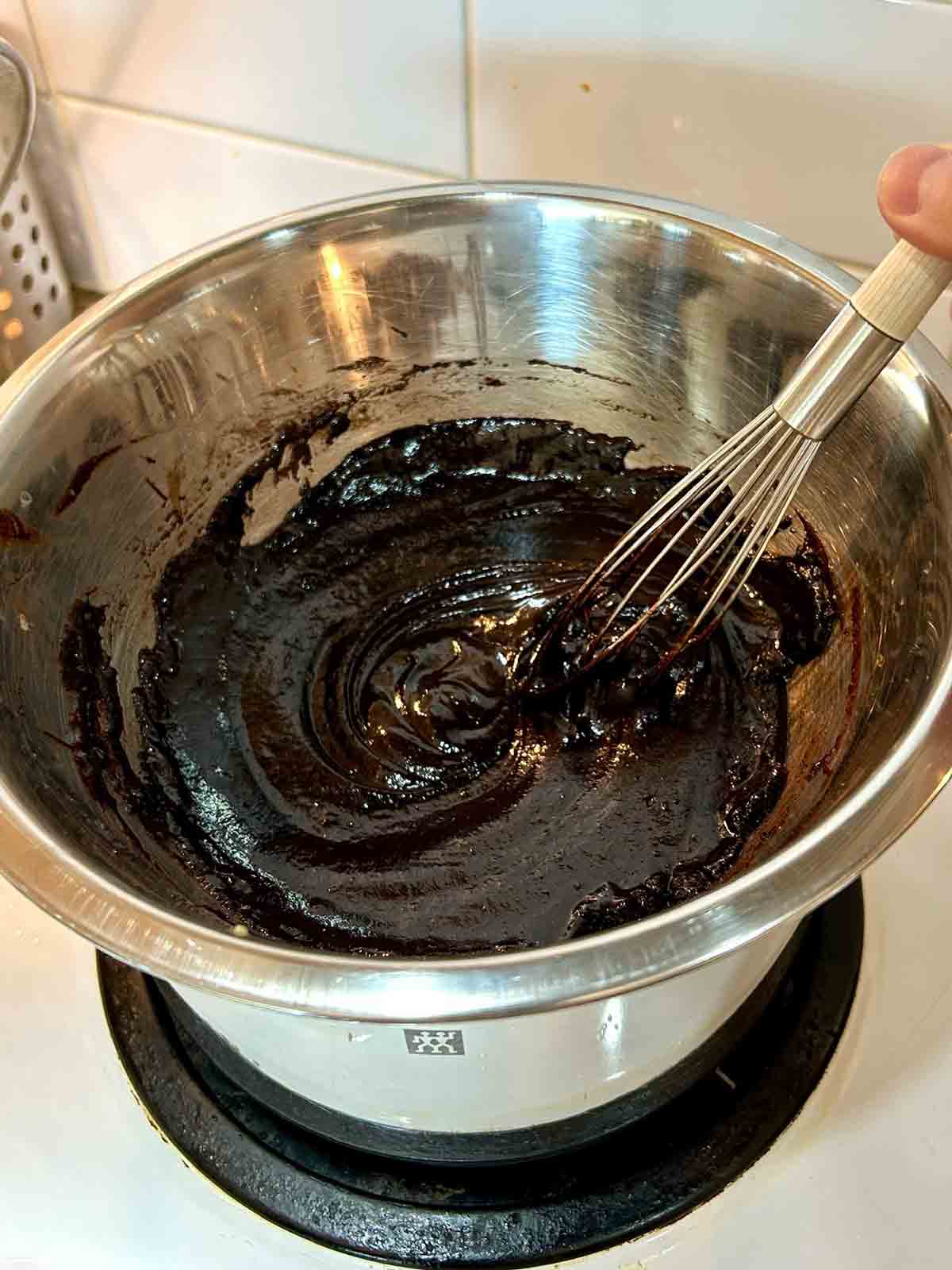 butter, cocoa powder, and egg mixture being thickened in double broiler.