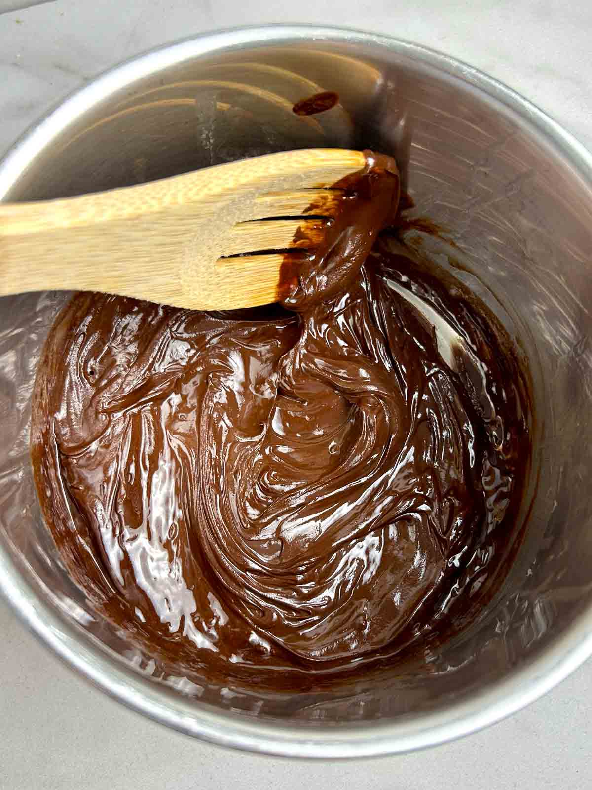 dark chocolate and butter being melted in bowl.