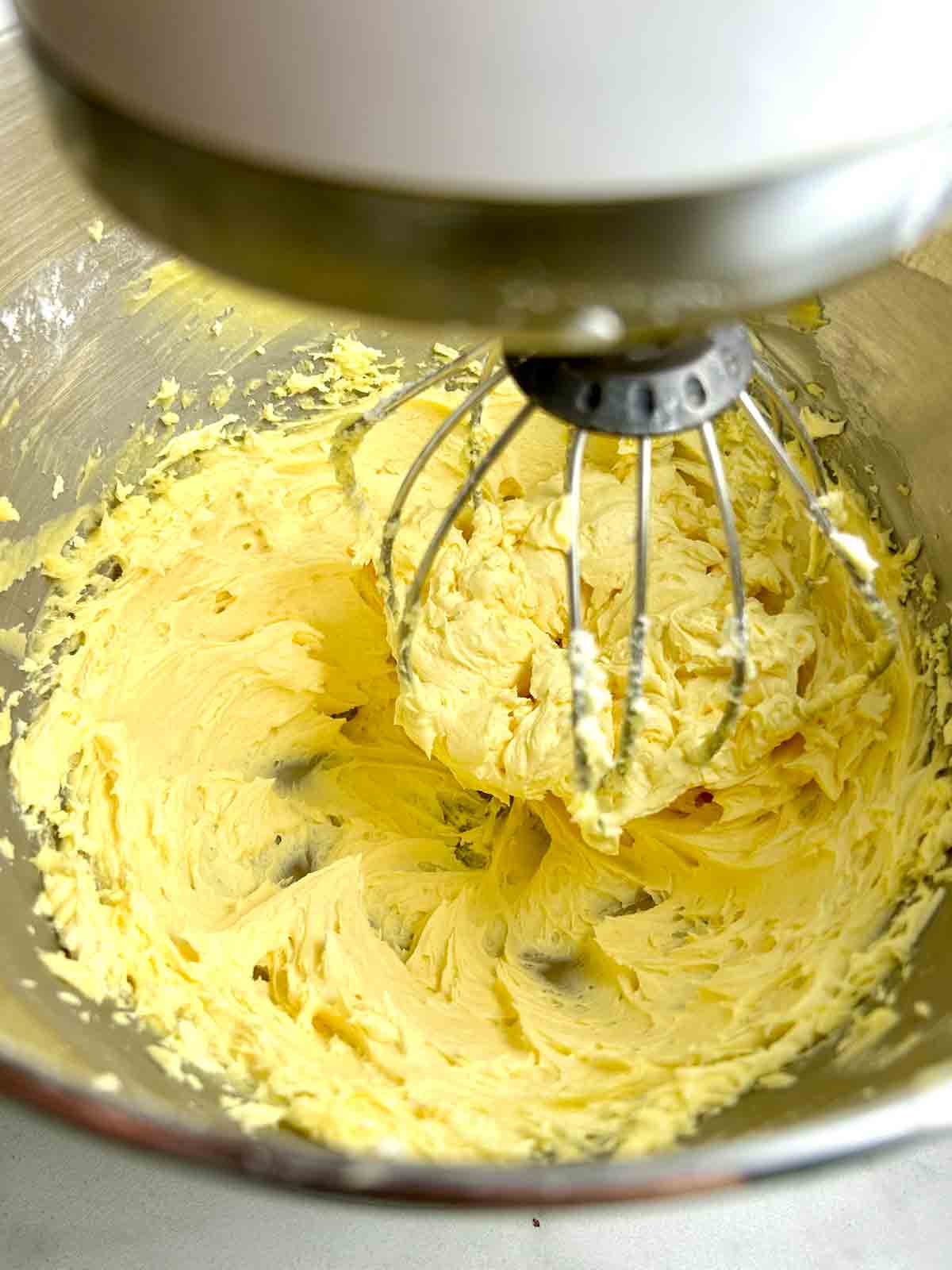 butter being whipped in stand mixer.