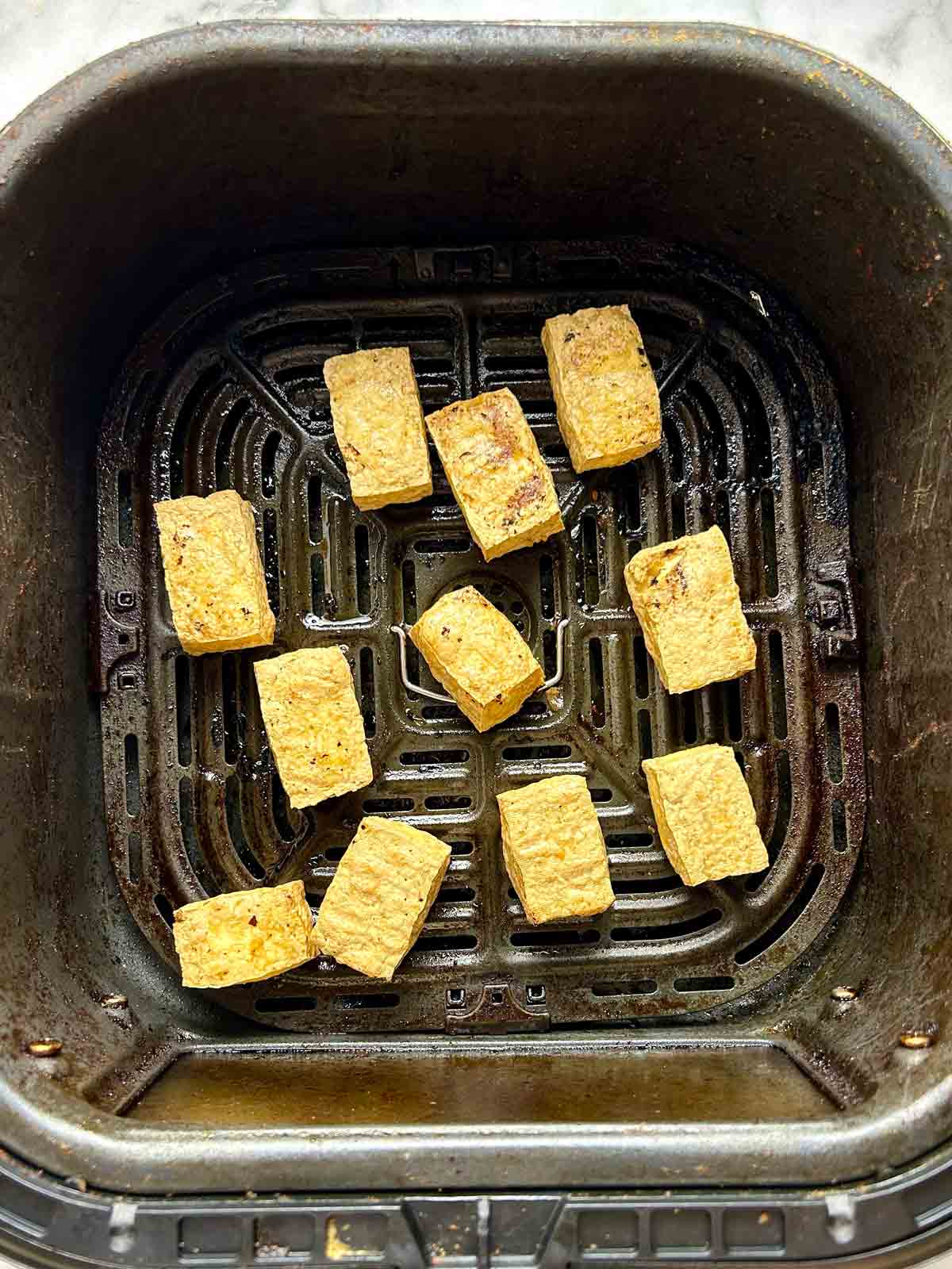 golden brown tofu after being air-fried.