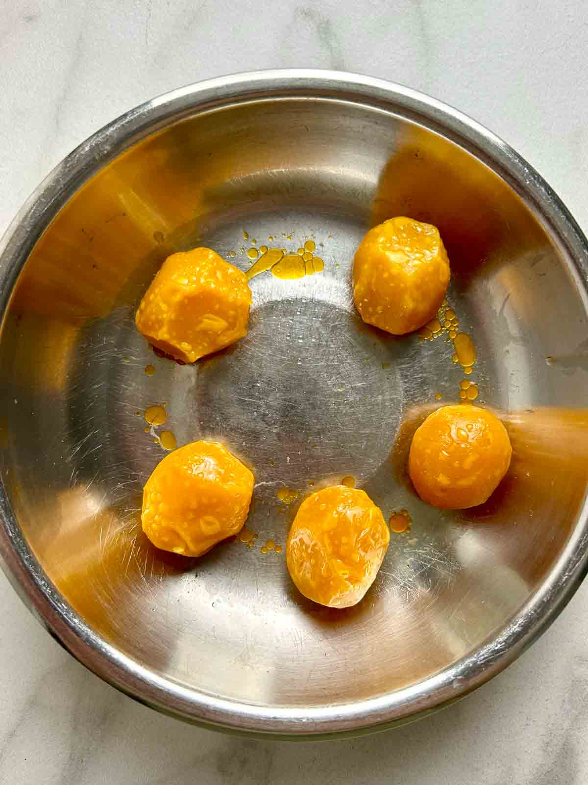 cooked salted egg yolks in steaming dish.