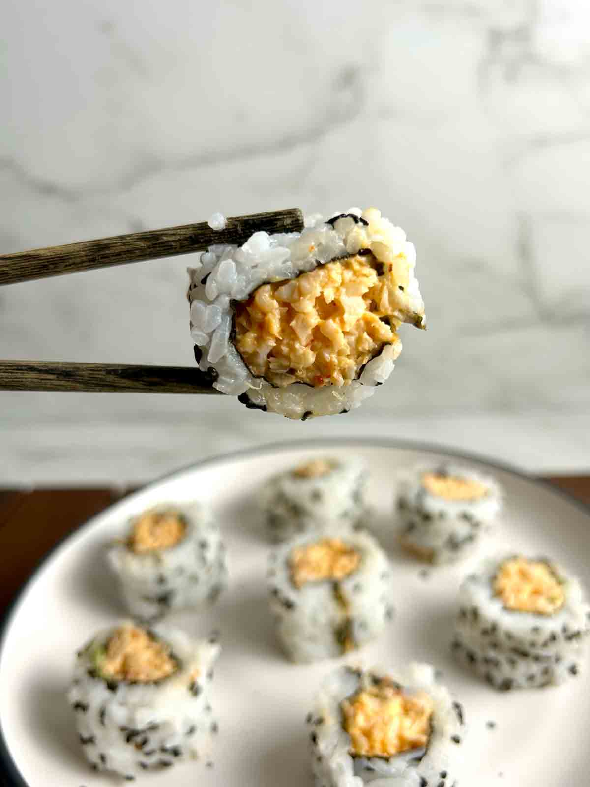 close up of piece of spicy shrimp roll.