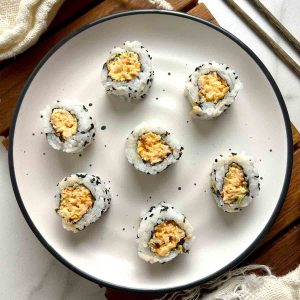 plate of spicy shrimp roll sushi.