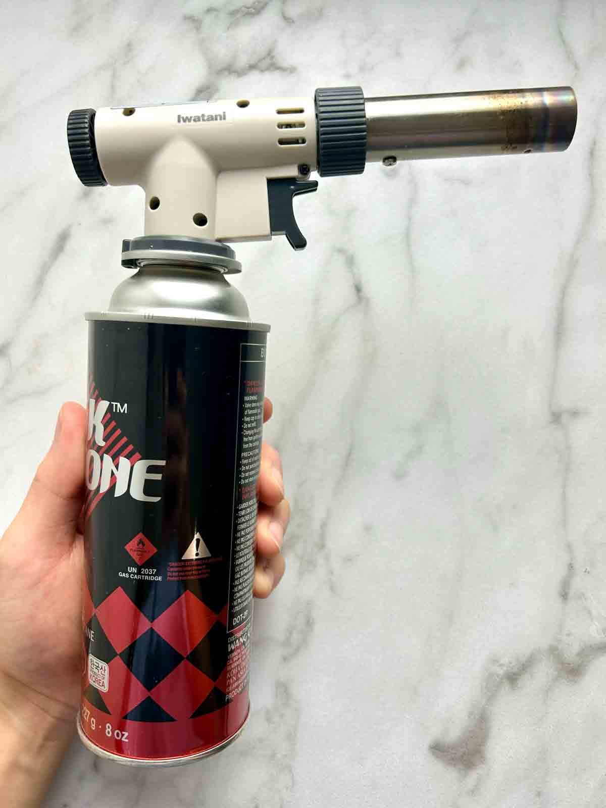 blowtorch with butane canister.