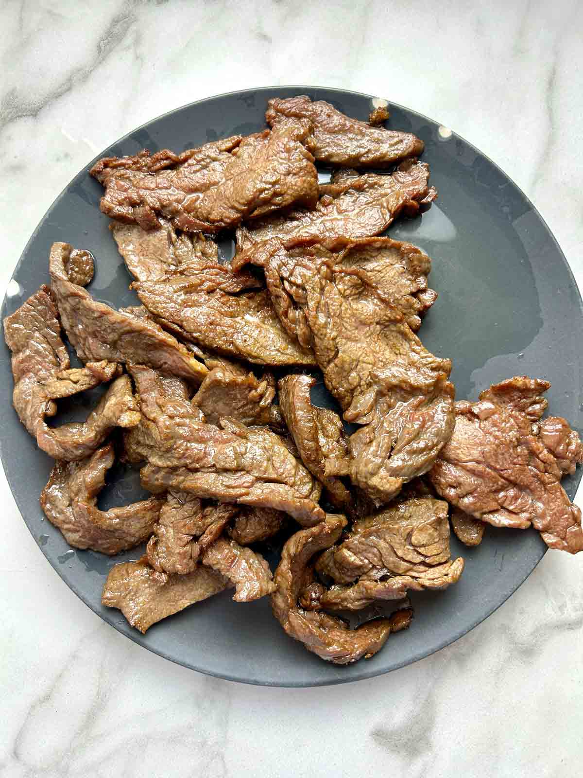 flank steak slices after deep-frying.