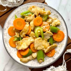 plate of chicken with mixed vegetables stir-fry.