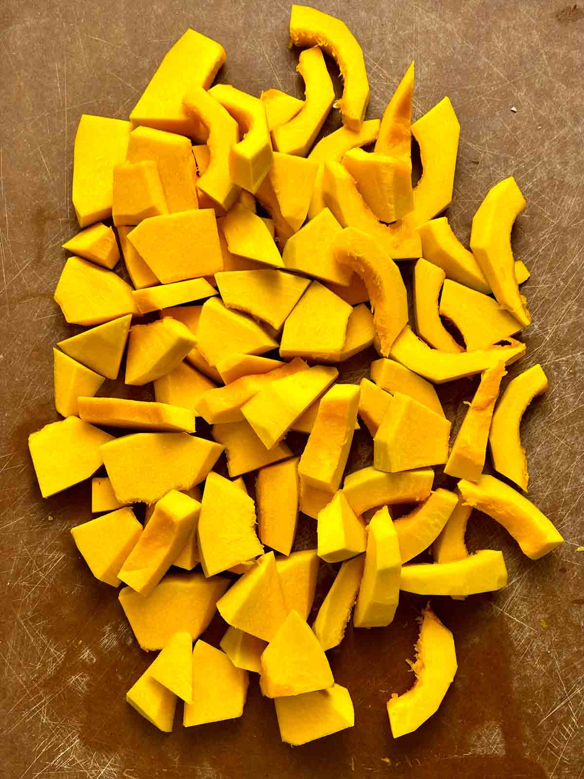 sliced kabocha pumpkin on cutting board.