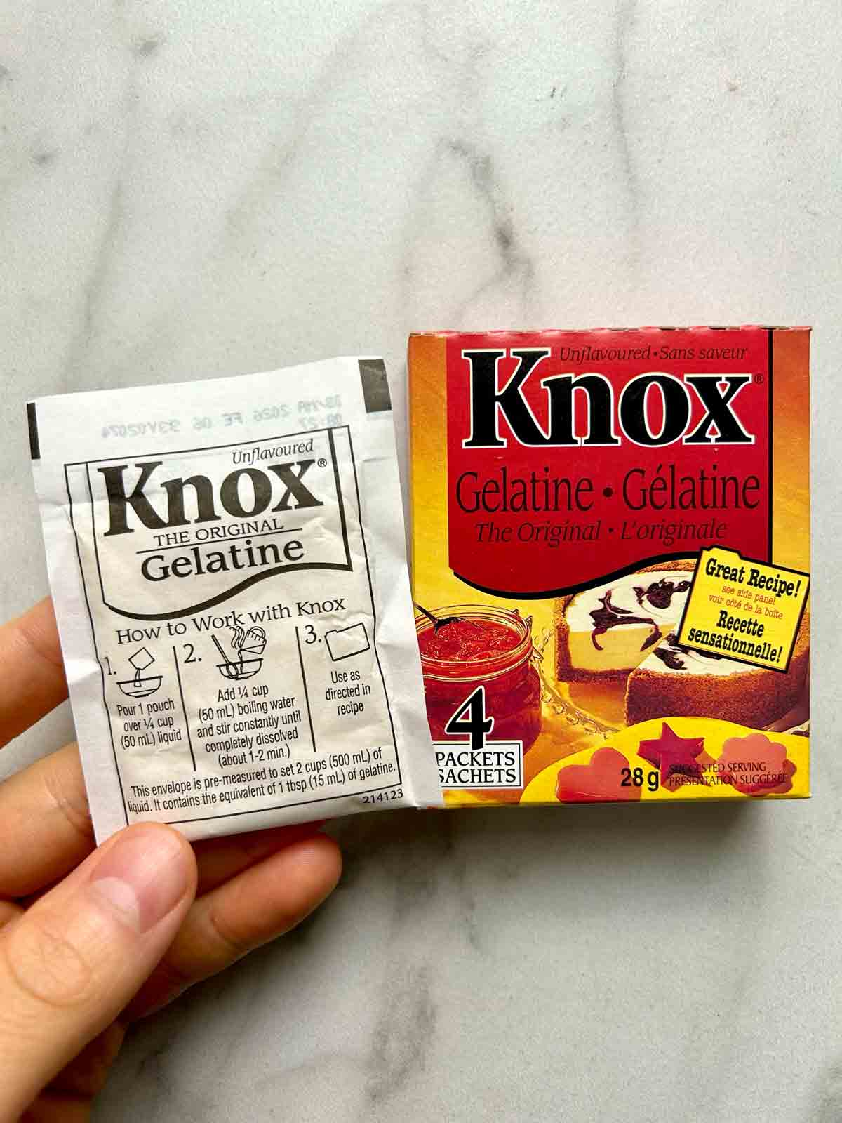 envelope of Knox gelatin powder next to its box.