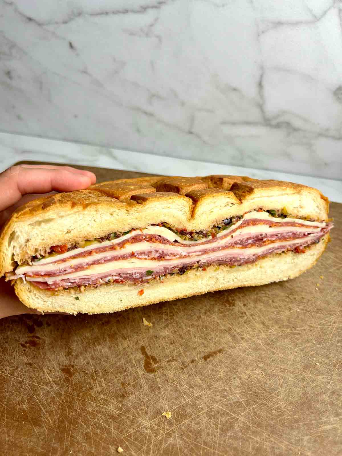 cross section of muffuletta sandwich.